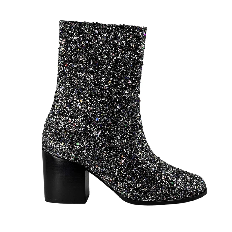 Women's patent leather stiletto heel pumps with a high - shine finish'Menos' vegan mid-calf boot by Zette Shoes - silver glitter
